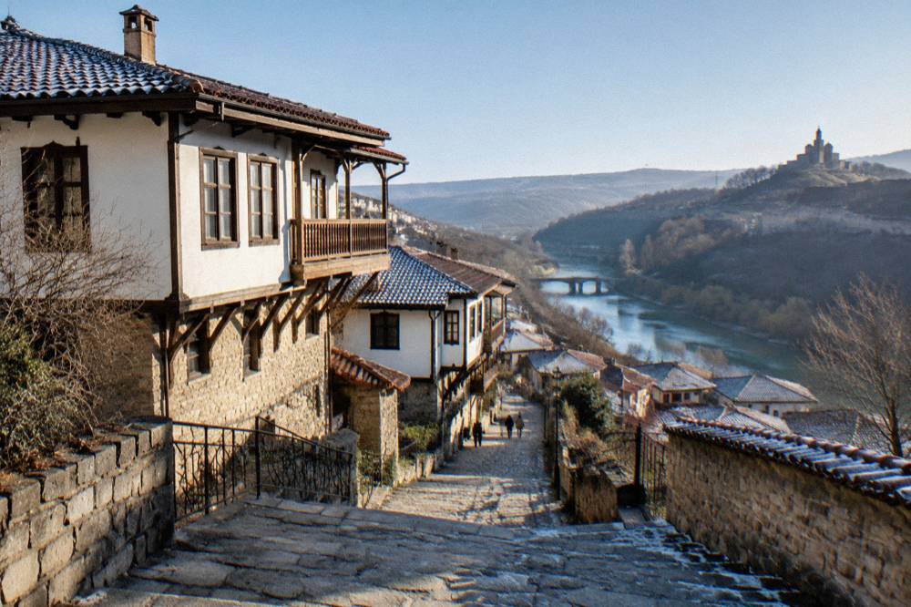 A historic street in Veliko Tarnovo seen from a stone stairway on a bright day