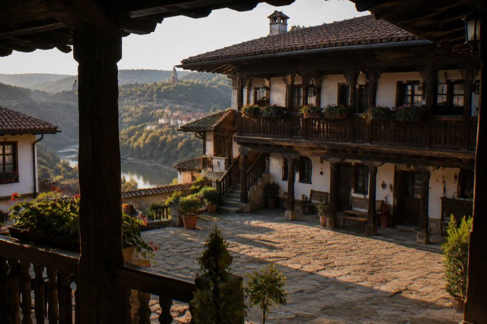 Wooden balconies and deep eaves of an old inn courtyard in Bulgaria