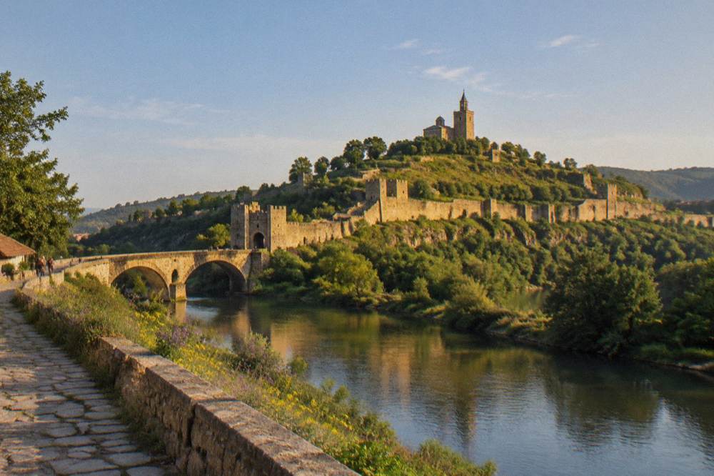 Warm evening light on the fortress hill seen from a riverside street