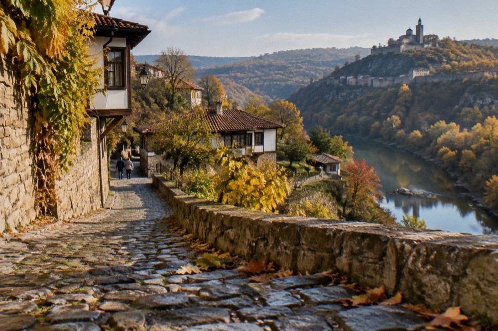 A river gorge in autumn colours with old houses high above the water