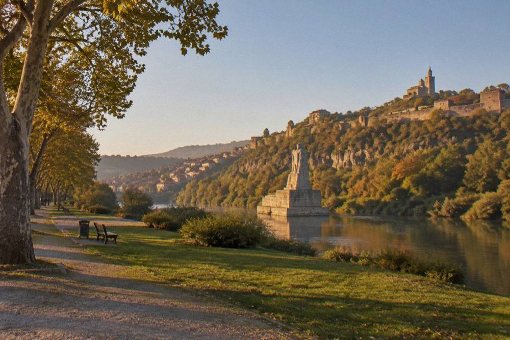 The Asenevtsi Monument standing in the Yantra river below the fortress walls of Veliko Tarnovo