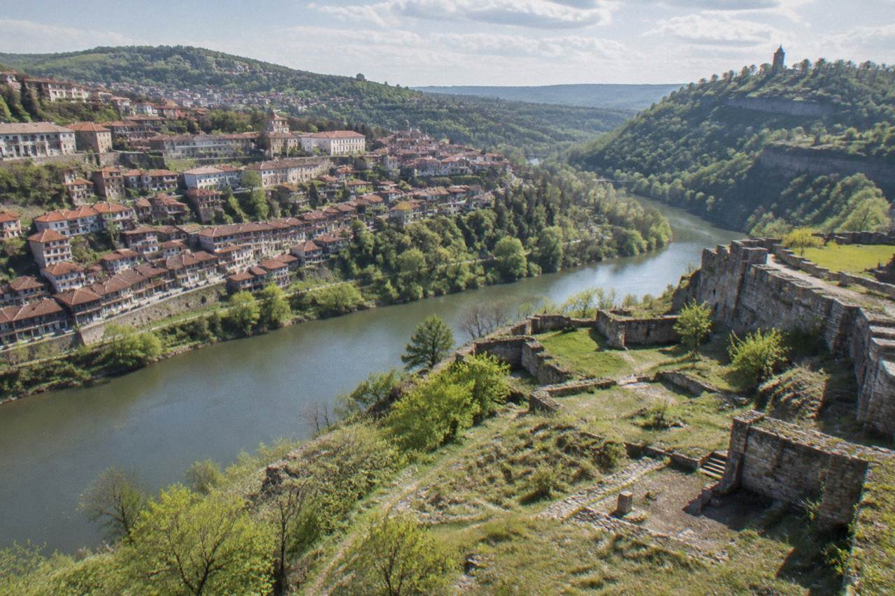 Stone walls of Trapezitsa Fortress on a wooded hill above the Yantra river in Veliko Tarnovo
