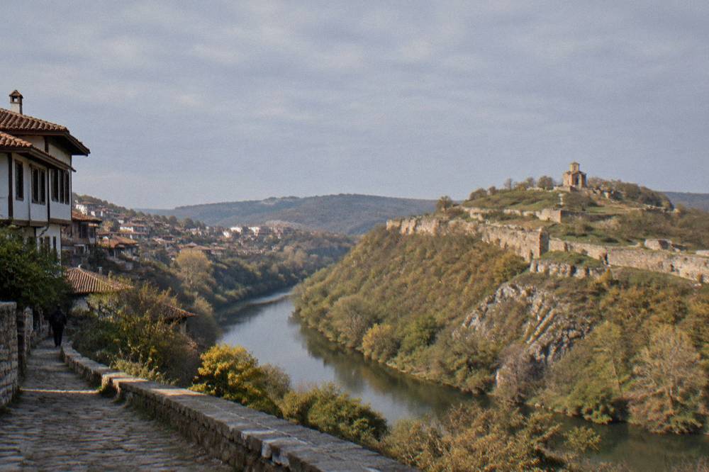 Old revival-era houses on a sloping street above a river gorge