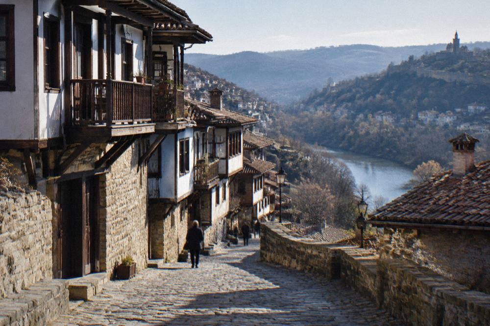 An old town street with wooden houses on a hillside