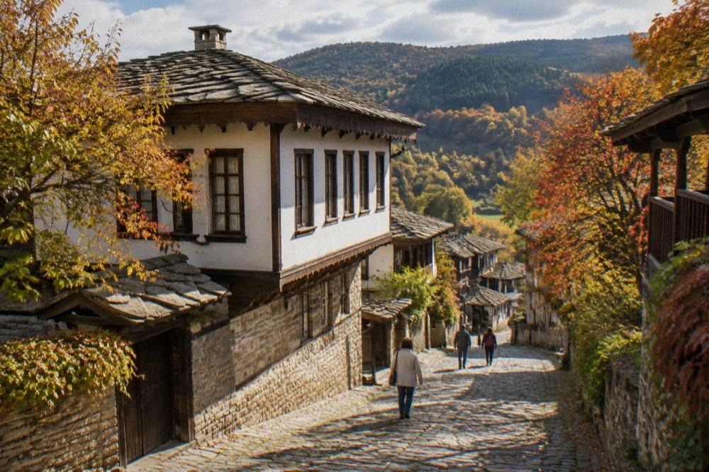 Autumn trees in gold and red along a valley road in the Balkan mountains