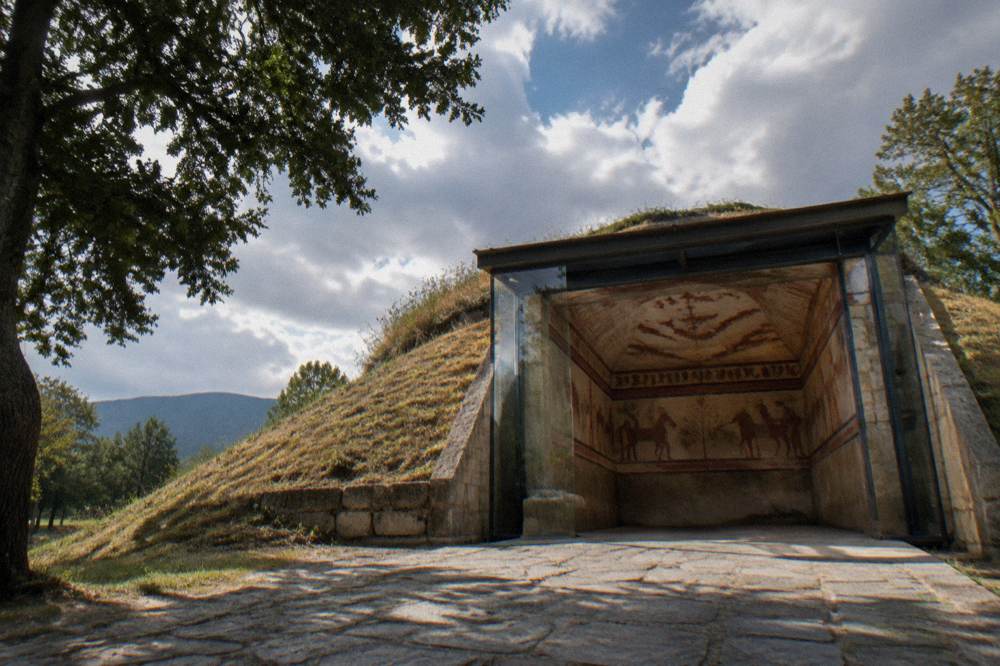 A replica Thracian tomb interior with painted murals on the vault