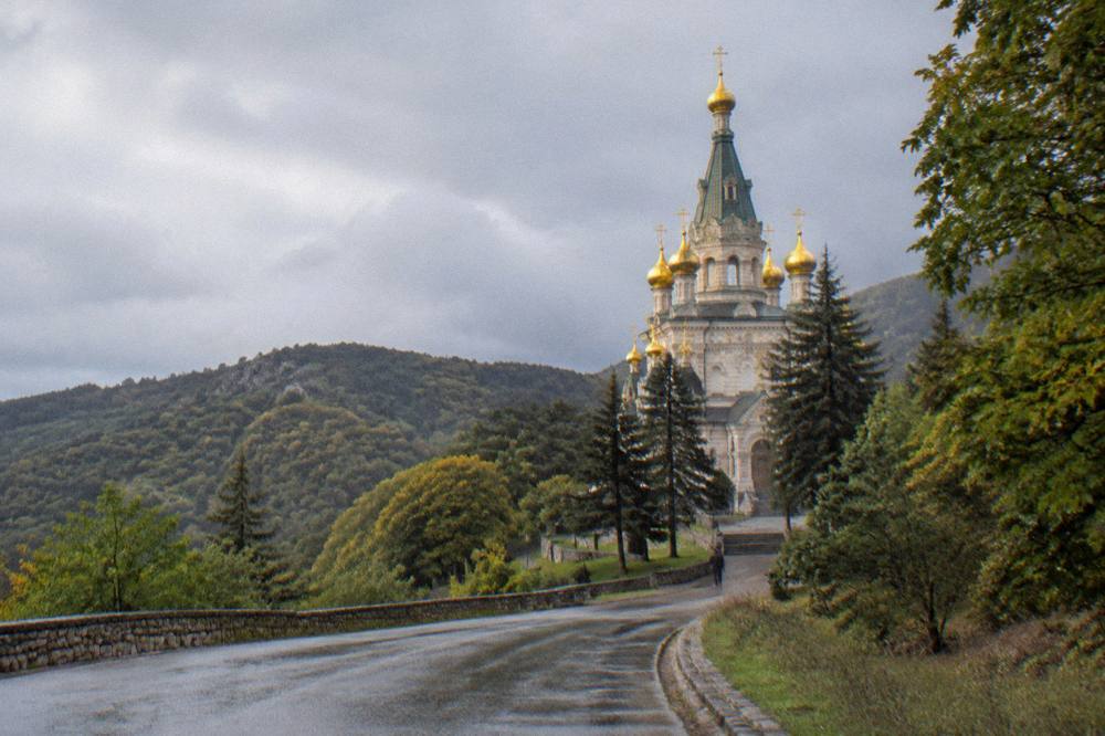 The Shipka Memorial Church seen from the road with green slopes around it