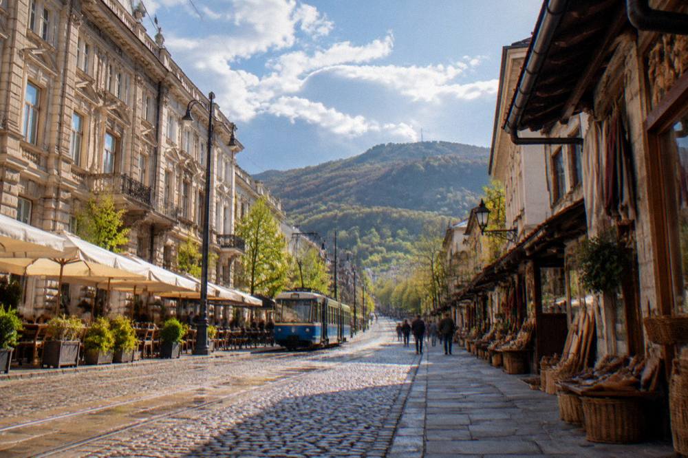 A cobbled historic street lined with small craft workshops