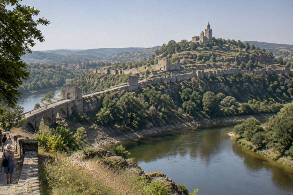 Tsarevets fortress hill seen across the Yantra river bend under a summer sky