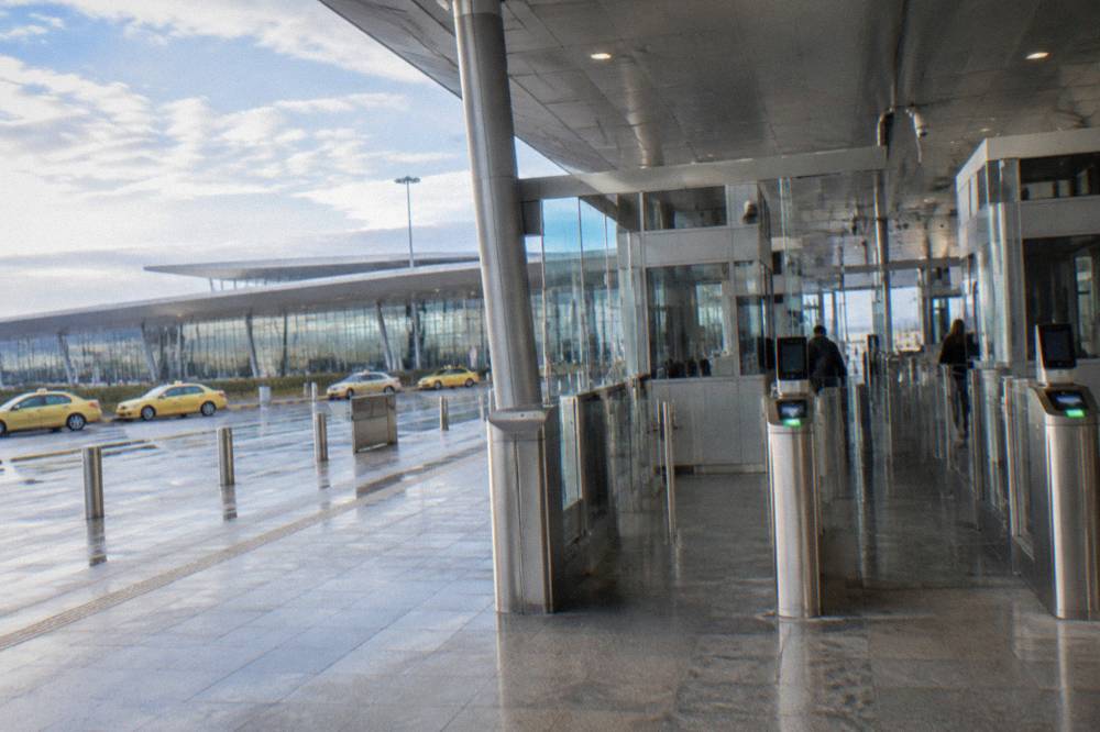 A border control booth with electronic gates at an airport