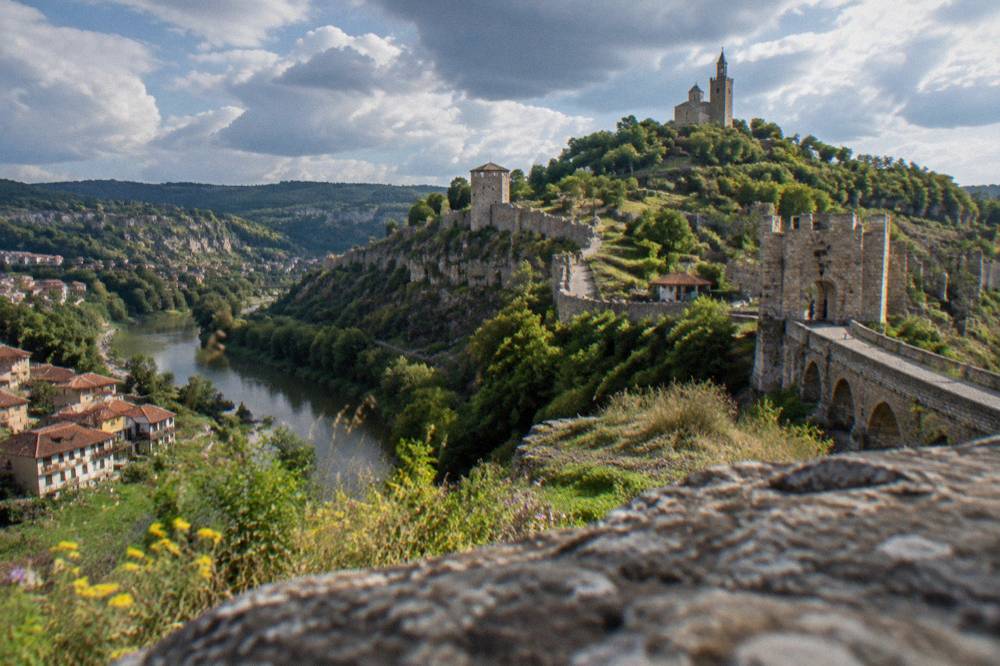 Stone fortress walls and tower on Tsarevets hill above Veliko Tarnovo