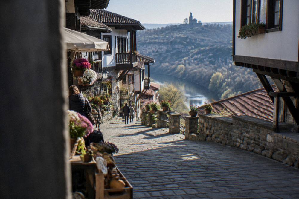 Flowers and craft stalls along a pedestrian street in the old town