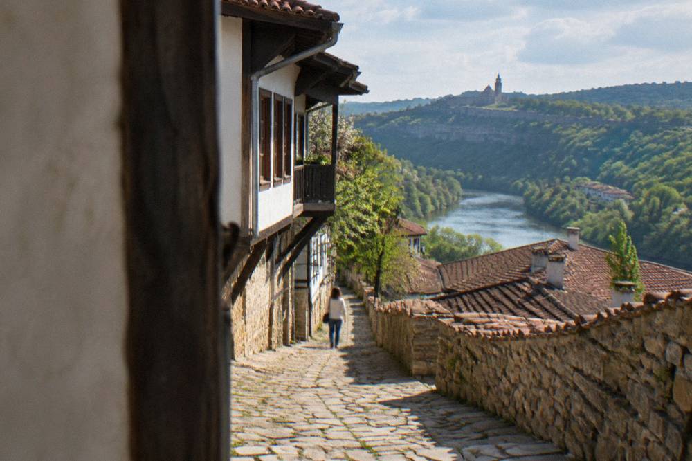 A weathered stone wall beside a cobbled lane in the Veliko Tarnovo old town