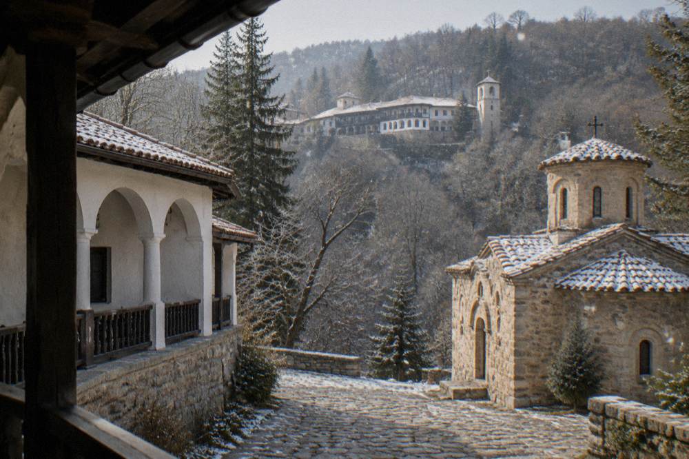 Hillside monastery buildings seen across a wooded valley in central Bulgaria