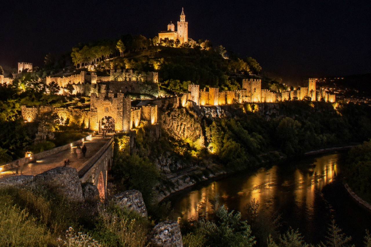 Illuminated Tsarevets Fortress above the Yantra river on a festival evening