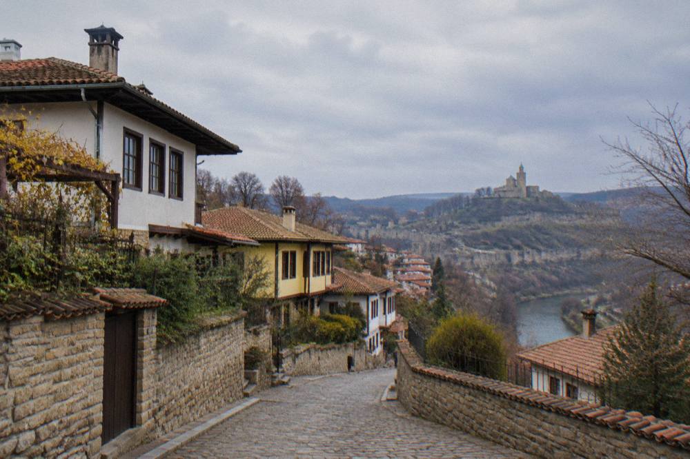 A cobbled street in the Varosha old quarter of Veliko Tarnovo with traditional houses on the slope