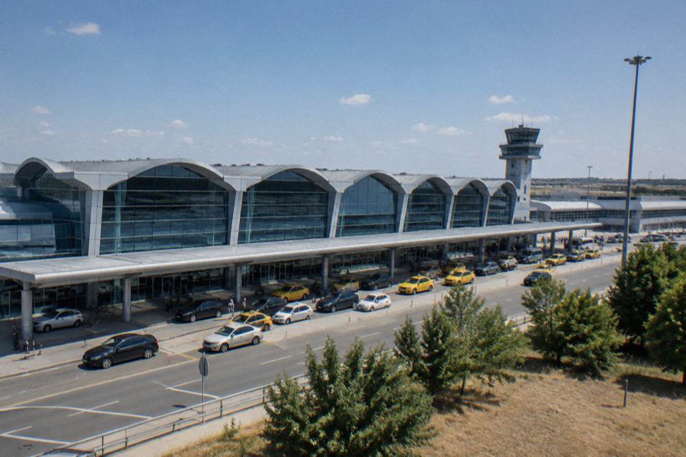 Bucharest Otopeni airport terminal building seen from the access road