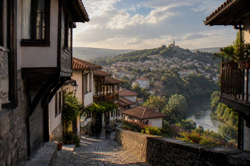 Red tile roofs of Veliko Tarnovo old town on a hillside in warm evening light