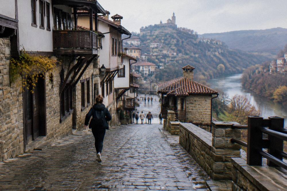 Steep cobbled lane with old houses climbing a hillside in Veliko Tarnovo