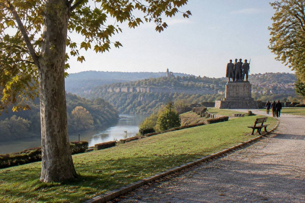 The Asenevtsi Monument of four armed figures on a stone pedestal above the Yantra river bend