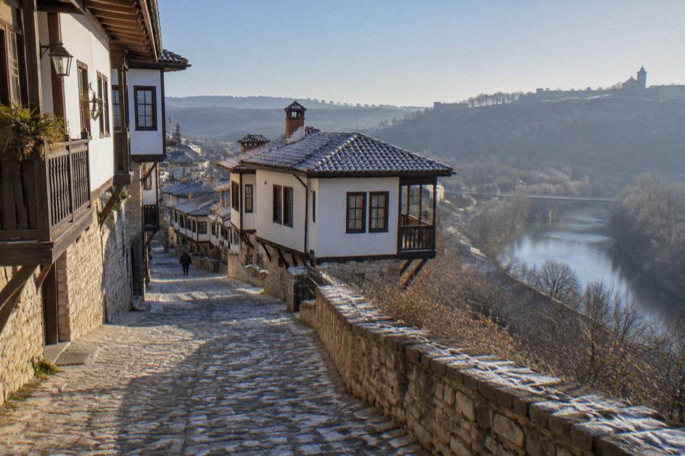 Traditional Revival-era houses on a steep street above the Yantra river in Veliko Tarnovo