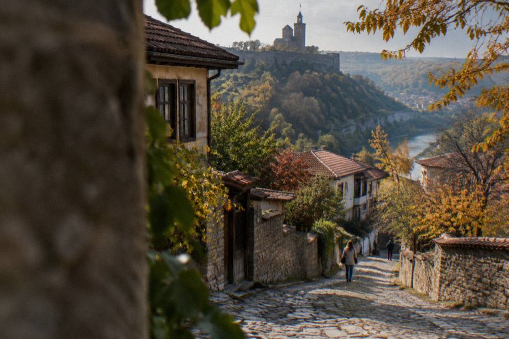 Cobbled street in the Varosha quarter with spring trees beginning to leaf