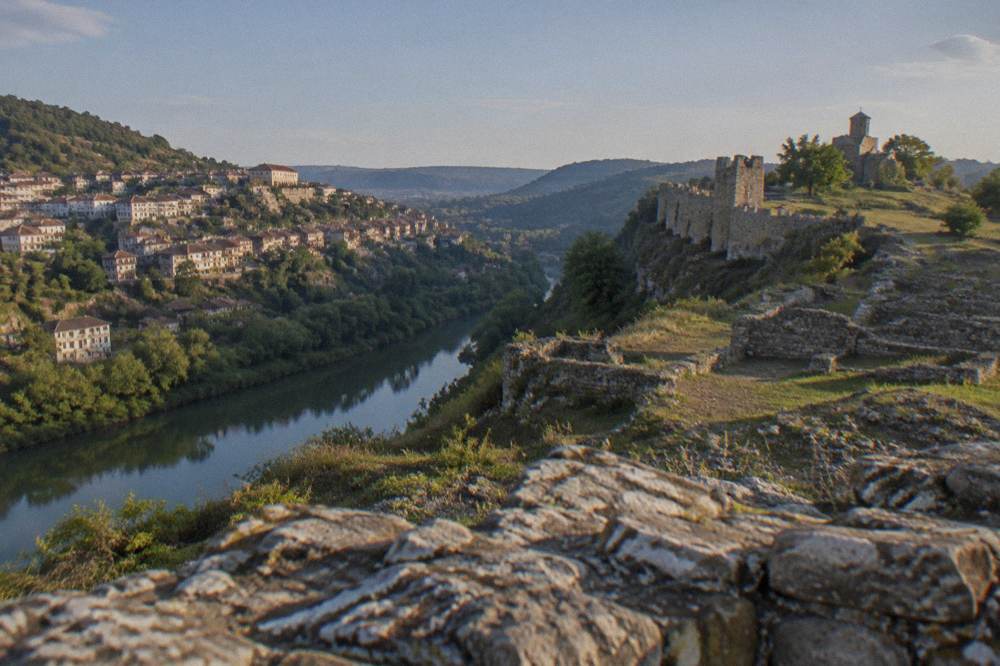 The stone walls of Trapezitsa fortress above the Yantra river opposite the old town