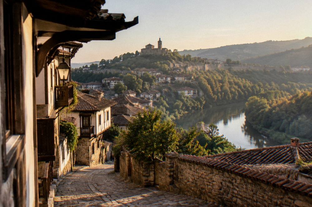 Rooftops of Veliko Tarnovo old town seen from above the Yantra river bend in evening light