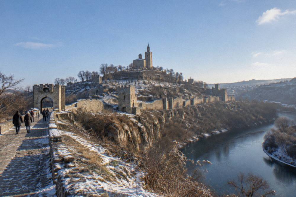 The walls of Tsarevets Fortress dusted with snow above the Yantra river