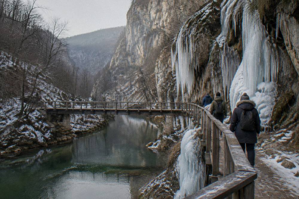 Icy waterfalls and cliff walls along the eco trail at Emen Canyon in winter