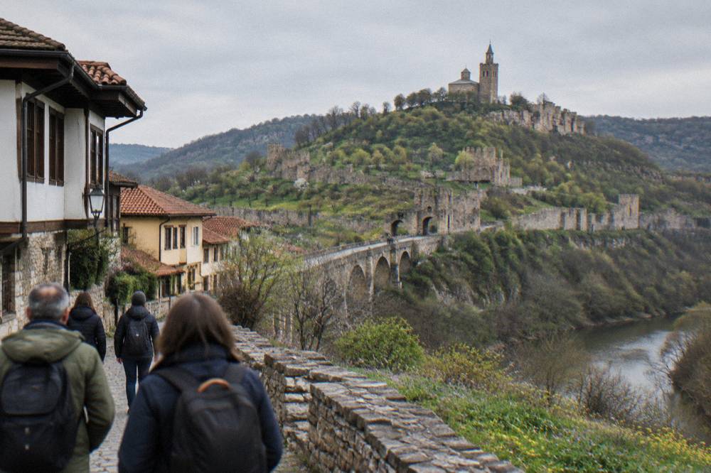 Guided walking group on a street below the fortress walls